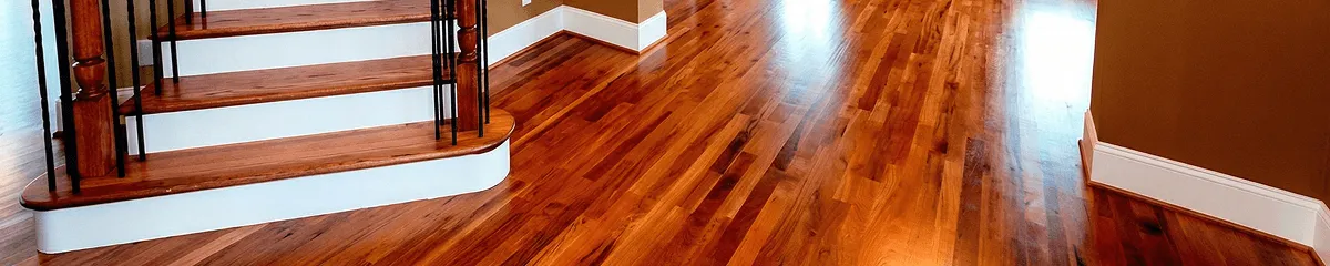 Base floor of a staircase with professionally restored wood flooring in Overland Park KS