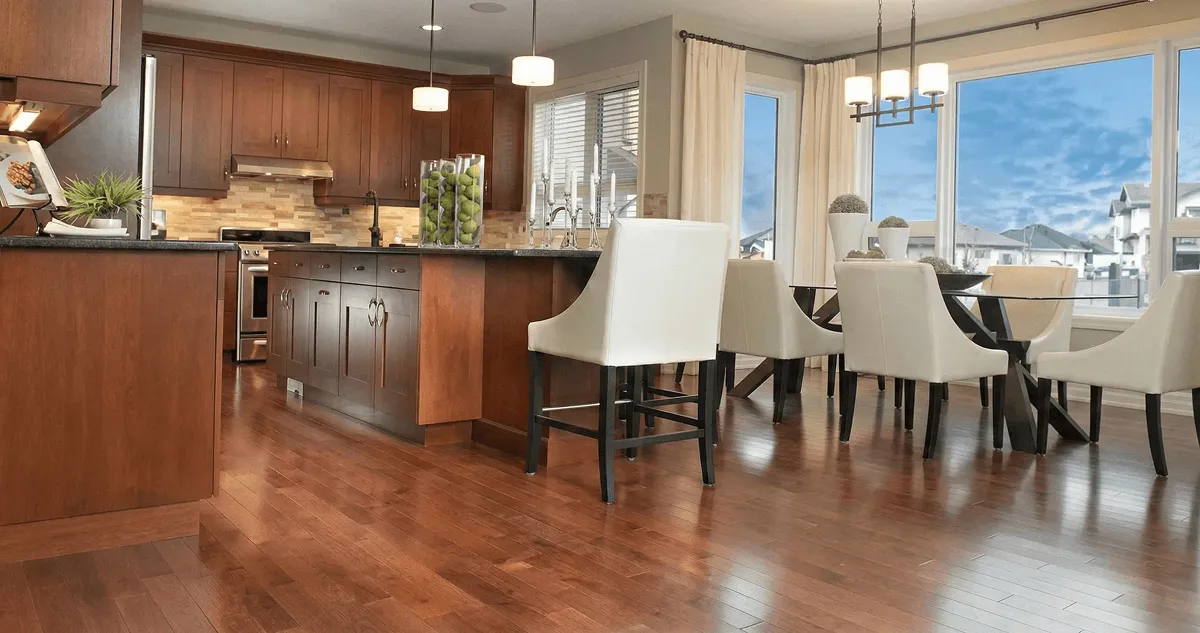 A modern kitchen with professionally installed wood flooring in Overland Park, KS